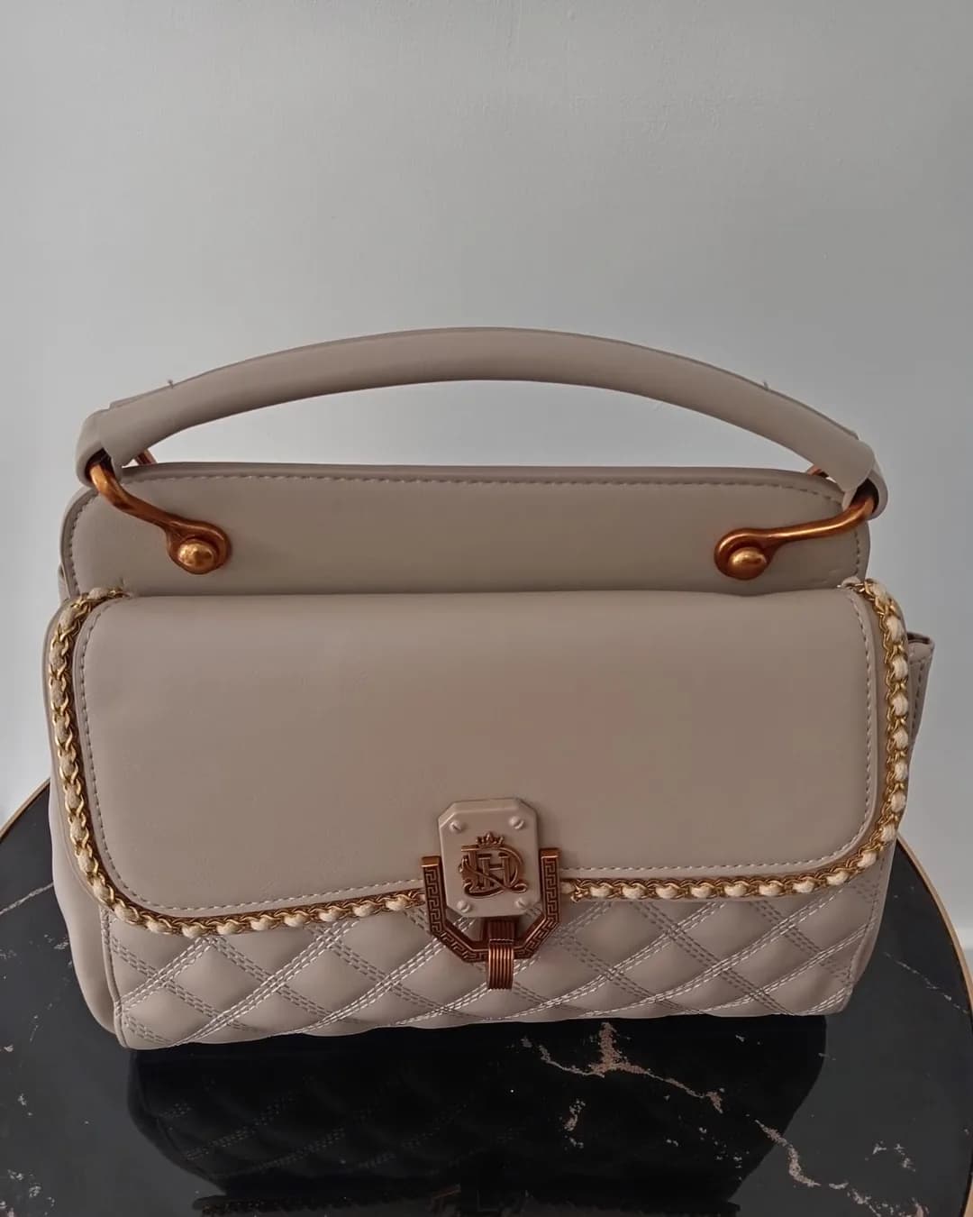 The Studded Bag in Beige, front view