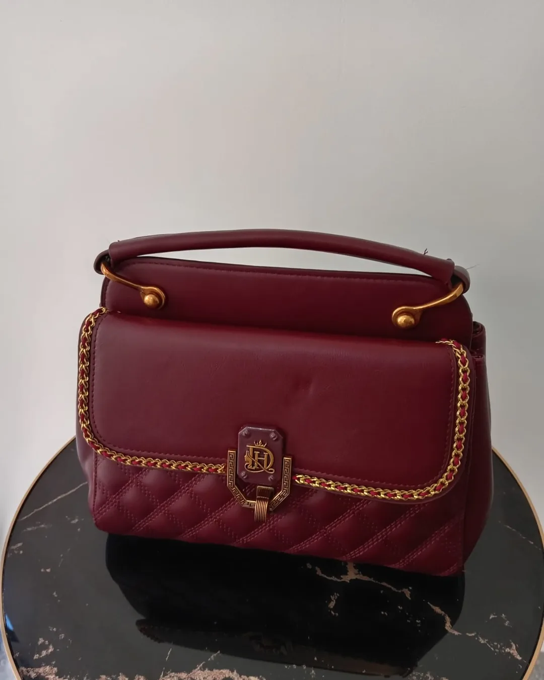 The Studded Bag in Burgundy, front view