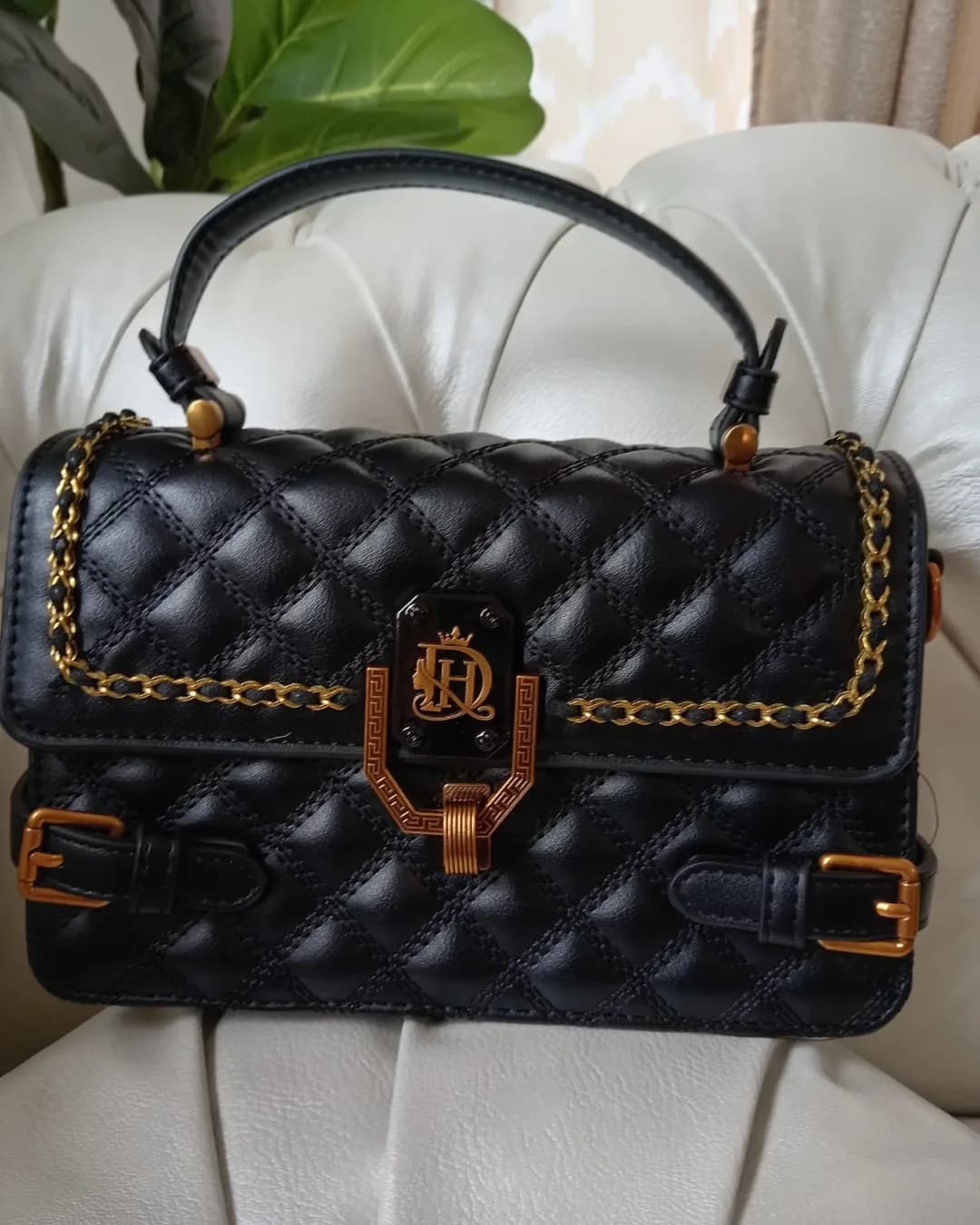 The Buckle Bag in Black, front view